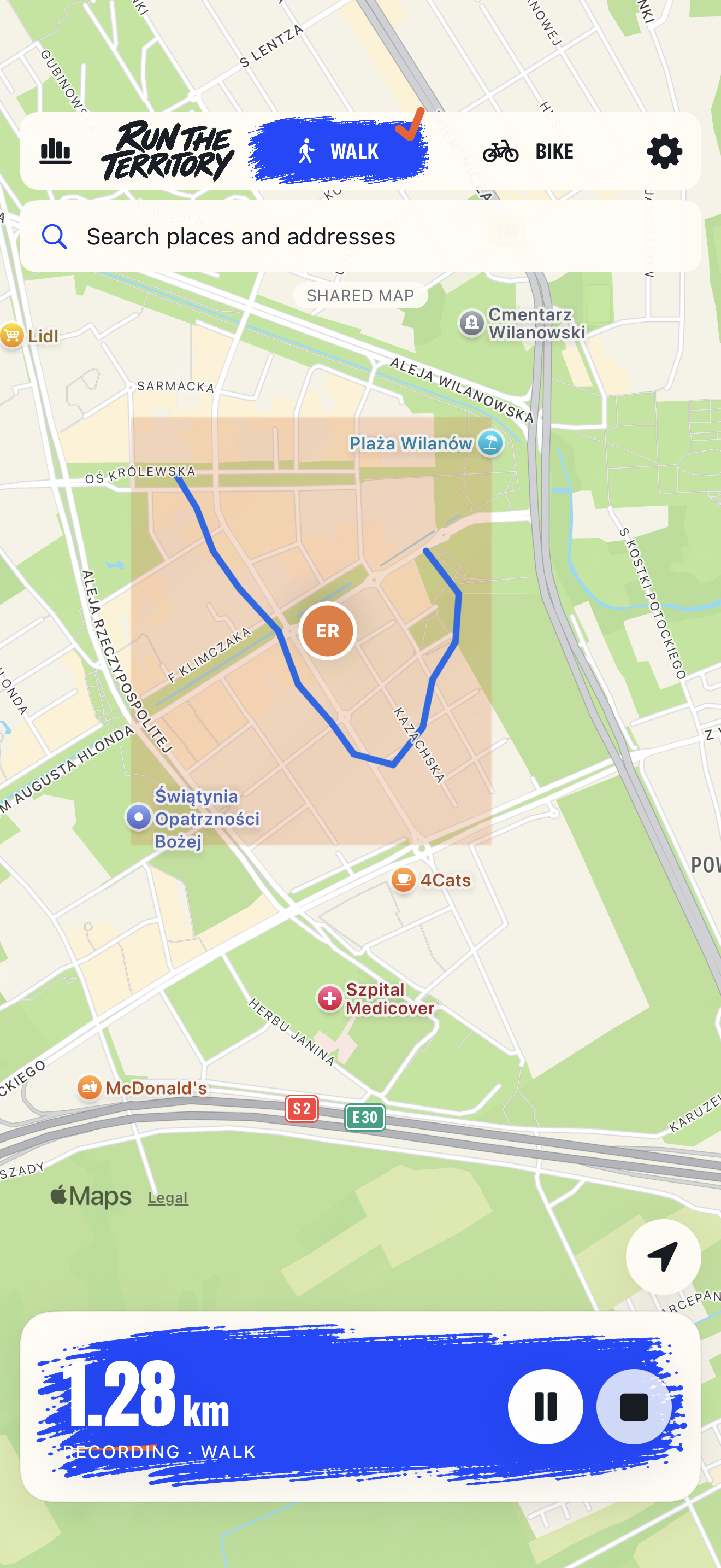 Run the Territory on iPhone: blue recorded route and orange captured territory